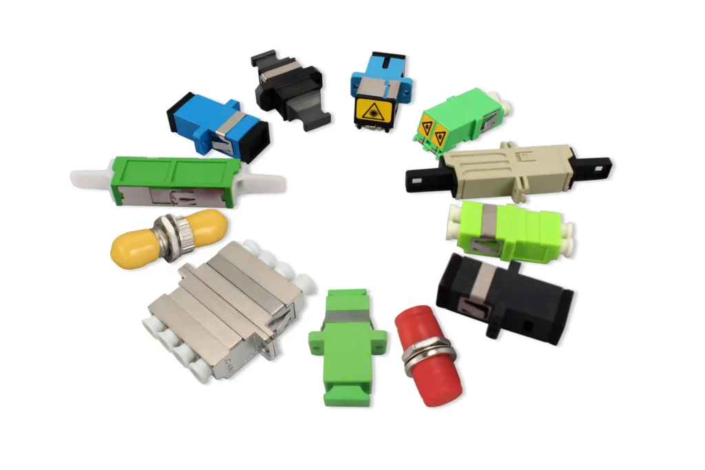 Studio image of different types of fiber optic adapters on white background